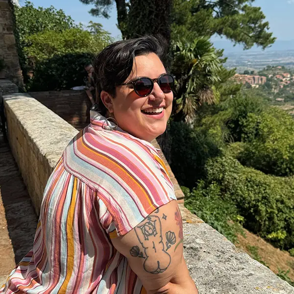 Libia Marqueza Castro overlooking city scenery on a sunny day